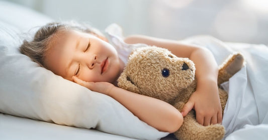 Child Sleeping in Bed