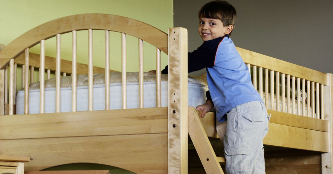 Child climbing a bunk bed