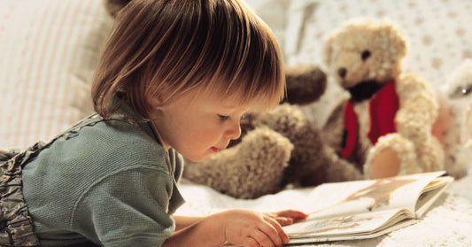 Child reading in bed